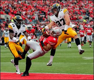 Ohio State WR Evan Spencer (6) can't make the catch as Iowa SS John Lowdermilk (37) and CB Desmond King (14) defend during the second quarter.