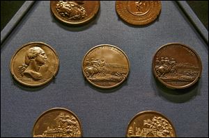Commemorative medals from the late 1700s are part of the collection at the new library at Mount Vernon.