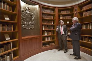 Doug Bradburn, founding director of the Fred W. Smith National Library for the Study of George Washington, left, talks with Curt Viebranz, president and CEO of George Washington’s Mount Vernon Estate, Museum, and Gardens, in the Rare Books Vault of the new library in Virginia. 