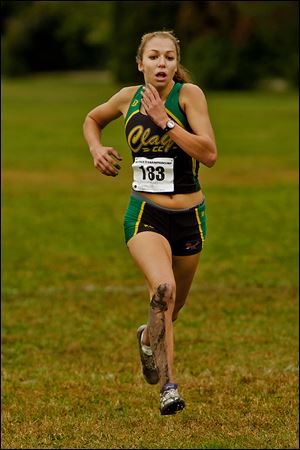 Clay senior Erin Gyurke won the District 2 race to lead her team to a title.