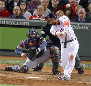 Boston's Shane Victorino hits a grand slam off Detroit’s Jose Veras in the seventh inning of Game 6 of the American League Championship Series. The Red Sox beat the Tigers to reach the World Series where they will face the St. Louis Cardinals.