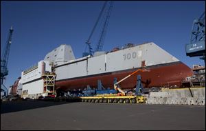 The first-in-class Zumwalt, the largest U.S. Navy destroyer ever built, is seen at Bath Iron Works in Bath, Maine. The christening of the Zumwalt was canceled once because of the government shutdown. But plans call for the ship to be moved to dry dock in Maine and floated without fanfare in the coming days.
