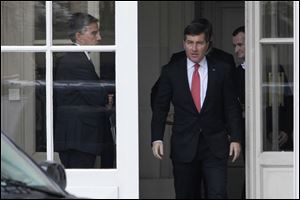 U.S Ambassador to France Charles H. Rivkin, right, leaves the Foreign Ministry in Paris, after he was summoned today by the French government over reports of NSA surveillance of French phone calls.