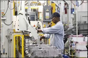 GM employees work at Powertrain. GM said the plant produced its 2.5 millionth six-speed front-wheel drive transmission last week.