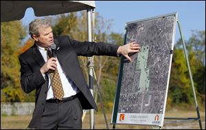 David J. Livingston, president of Lourdes University, explains project plans for the campus expansion during a ceremony at Brint and McCord roads. 