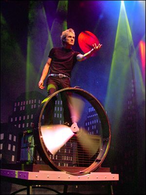 Illusionist Kevin Spencer says his show 'is a combination of my love of theater and love of magic.' He and his wife, Cindy, perform Sunday in Findlay.