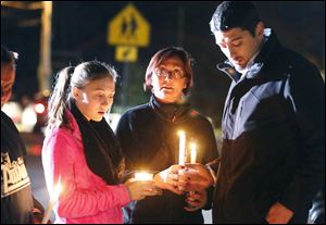 Parents and Danvers High School students hold candlelight vigil to mourn the death of Colleen Ritzer, a 24-year-old math teacher at Danvers High School Wednesday.