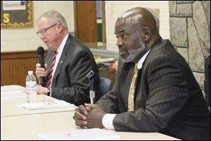 Toledo Mayor Mike Bell and his challenger, City Council member D. Michael Collins debate at the East Toledo Senior Center, Thursday.