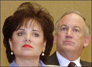 Patsy Ramsey and her husband, John, parents of JonBenet Ramsey, look on during a news conference in Atlanta in May, 2000.