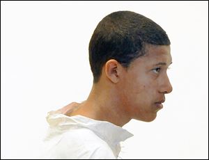 Philip Chism, 14, stands during his arraignment for the death of Danvers High School teacher Colleen Ritzer in Salem District Court in Salem, Mass., Wednesday.