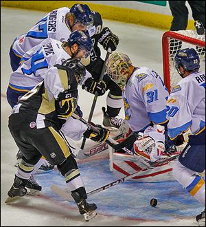 Walleye goaltender Mac Carruth blocks a shot by Wheeling during the second period. The rookie netminder notched 30 saves in his home debut.