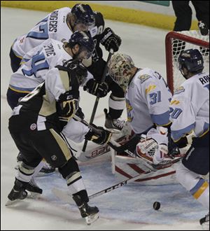 Walleye goalie Mac Carruth (31) blocks a shot on goal during the second period.