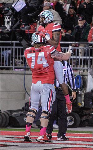 Ohio State offensive lineman Jack Mewhort congratulates wide receiver Corey Brown on his touchdown against Penn State during the second quarter.