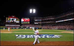 Boston Red Sox shortstop Stephen Drew walks back to the dugout after striking out to St. Louis Cardinals starting pitcher Adam Wainwright in the second inning.