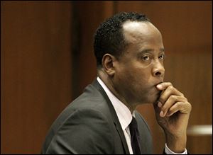 Michael Jackson's former doctor Conrad Murray sits in a courtroom during his involuntary manslaughter trial in Los Angeles in October, 2011.