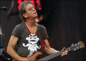 Shown performing in 2009  at the Lollapalooza music festival in Chicago, punk poet and  rock legend Lou Reed died Sunday of a liver-related ailment. He was 71. 