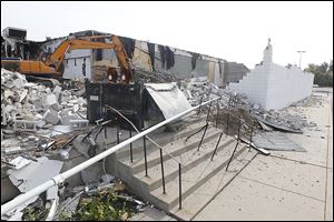 A demolition crew brings down the final curtain on the Franklin Park Cinemas at 5235 Monroe St. in Sylvania Township.