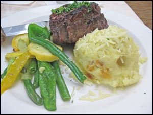 Grilled Filet with Bernaise sauced served with mashed potatoes and mixed vegetable from Del Sol in the Grand Plaza Hotel