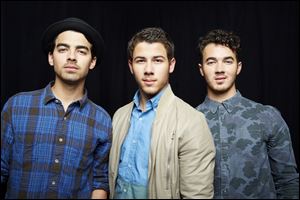 From left, Joe Jonas, Nick Jonas and Kevin Jonas, of American pop rock band The Jonas Brothers.