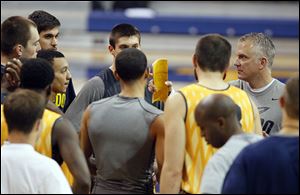 University of Toledo basketball coach Tod Kowalczyk, right, talks to his team during a recent practice. Kowalczyk says this is the deepest team he has had in 12 years of coaching.