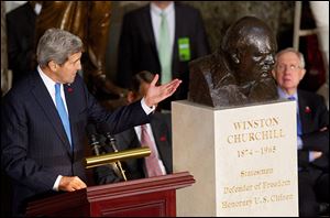 Secretary of State John Kerry, left, honors Winston Churchill during a ceremony dedicating a bust of the revered British leader in the Capitol’s Statuary Hall.