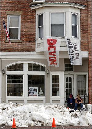 Snow created from ice chips and ‘welcome home’ signs outside Devin Kohlman’s apartment are signs of support shown by the Port Clinton community.