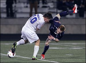 Anthony Wayne's Zach Harris, left, and St. Johns' Adam Naayers collide. The Generals improved to 16-0-4.