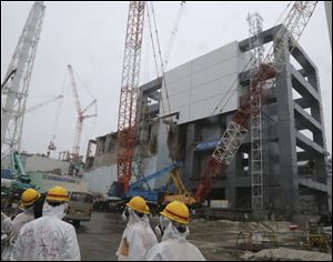The steel structure for the use of the spent fuel removal from the cooling pool is seen at the Unit 4 of the Fukushima Dai-ichi nuclear plant at Okuma in Fukushima prefecture, Japan in June.