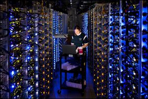 A Google employee diagnoses an overheated computer processor at Googles data center in The Dalles, Ore. 