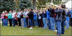 The Port Clinton High School marching band performs at a pep rally for  Devin Kohlman at Waterworks Park.