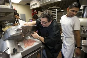 Angelo Lutz, preparing food in his Kitchen Consigliere in Collingswood, N.J., has turned to crowd-funding to raise money to expand his restaurant.  He said he was unable to obtain a loan from a bank as a convicted felon. ‘Fat Ange’ was convicted in a 2001 mob trial and served eight years in prison.