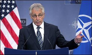 Defense Secretary Chuck Hagel today sharply criticized U.S. states that are defying the Pentagon by refusing to allow National Guard facilities to issue ID cards that enable same-sex spouses of military members to claim benefits. 