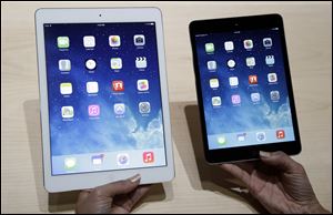 The new iPad Air, left, will be competing with its little brother, the iPad Mini. Apple recently unveiled the thinner, lighter iPad Air. The iPad Air weighs just 1 pound, making it less likely that your hand will cramp up while holding it for hours. It will face competition from a variety of other tablets.