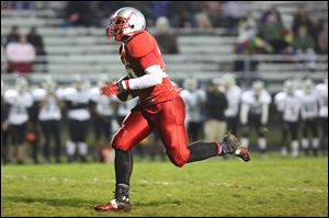 Bowsher's Mark Washington breaks away for a 27-yard touchdown to open the scoring barrage against Start.