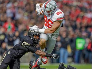 Ohio State tight end Jeff Heuerman, right, is hit by Purdue defensive back Anthony Brown on Saturday in West Lafayette, Ind. Heuerman caught a 40-yard touchdown pass in the first half.