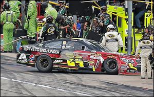 Jeff Gordon heads to the garage after he brushed the wall at Texas Motor Speedway in Fort Worth. Gordon came into the day third in the points standings but left in sixth place.