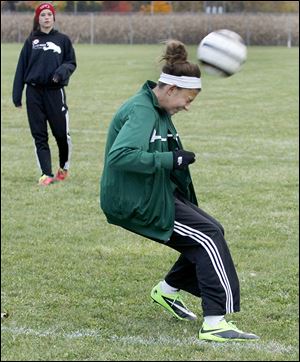 Emma Barney, a freshman, heads the ball during practice. Barney has 30 goals and 20 assists.