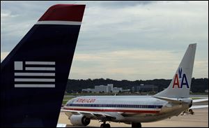 Attorney General Eric Holder said today that American Airlines and US Airways must make broad concessions if they want to settle a lawsuit blocking their proposed merger.