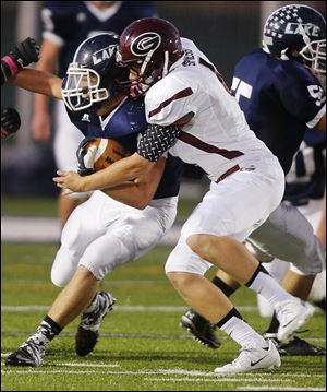 Quentin Spiess makes a tackle against Lake. The senior is Genoa's top receiver with 21 catches for 627 yards.