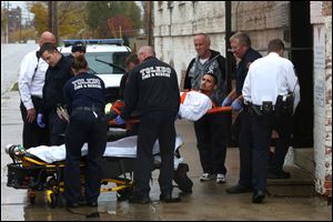 An unidentified man is taken out of the Volunteers of America Residential Reentry Program facility near downtown Toledo. Police said the man had been shot on Lagrange Street near North Ontario Street.  
