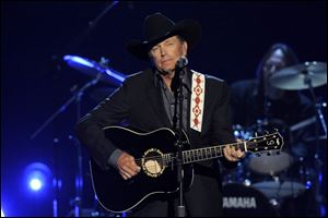 George Strait performing at the 48th Annual Academy of Country Music Awards at the MGM Grand Garden Arena in Las Vegas.