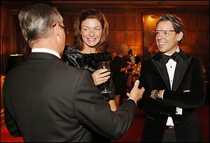 Ted Souder, right, of Google talks with his wife, Lori, and J.B. Rorick during the President’s Dinner at the Toledo Club.