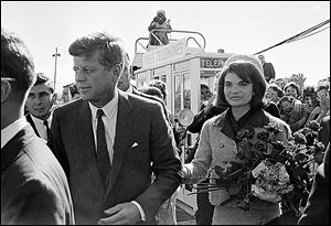 President John F. Kennedy and his wife, Jacqueline Kennedy, arrive at Love Field airport in Dallas on Nov. 22, 1963.