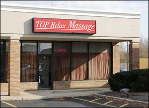 According to an FBI affidavit, a worker was alleged to have offered to perform a sex act at Top Relax Massage at 1855 S. Reynolds Rd. 