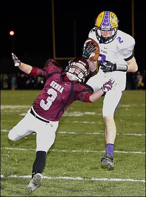Bryan's Sean Culler makes a catch against Genoa's Andrew Belcik in Friday night's playoff game.