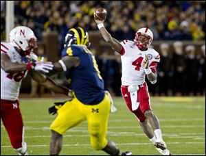 Nebraska quarterback Tommy Armstrong Jr. (4) throws a pass in the third quarter of an NCAA college football game against Michigan in Ann Arbor, Mich., Saturday.