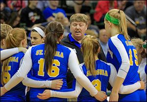 St. Ursula coach John Buck  gives instructions to his players during Saturday's state final.