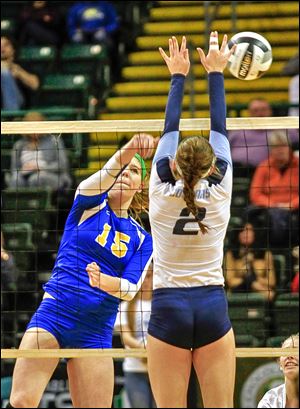 St. Ursula's Elizabeth Coil has her shot blocked by Cincinnati Mount Notre Dame's Mari Lingardo in Saturday's Division I state final at Wright State's Nutter Center. The Arrows finish the season 29-1.