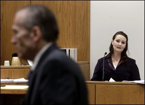 Gypsy Willis, who had an affair with Martin MacNeill, looks towards MacNeill from the witness stand during a recess in his murder trial Thursday in 4th District Court in Provo, Utah.