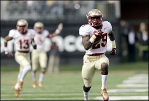Florida State defensive back Nate Andrews runs back an interception for a touchdown against Wake Forest on Saturday in Winston-Salem, N.C.